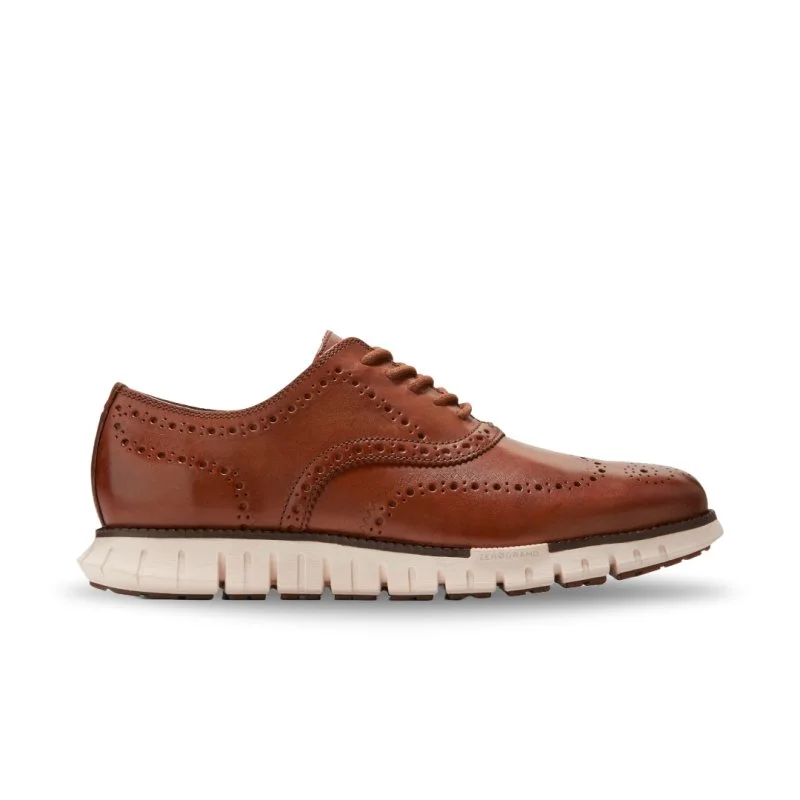 Men's Oxfords with a cap - toe design and a rubber heelCole Haan Men's ZEROGRAND Remastered Wingtip - British Tan/Ivory